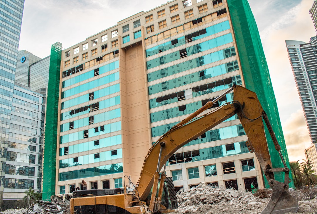 Construction equipment working on a high-rise building.