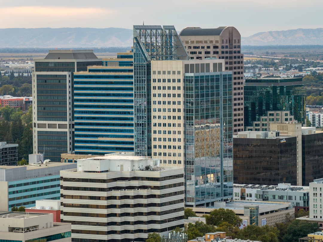 Modern skyscrapers rise above a cityscape.