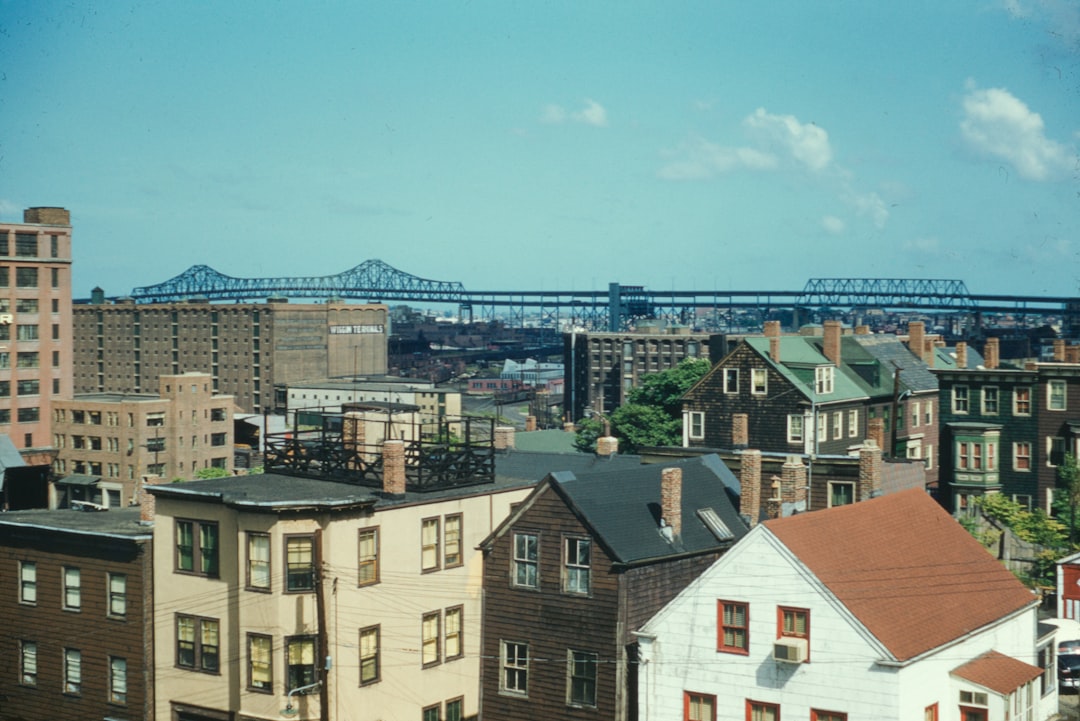 a view of a city with a bridge in the background